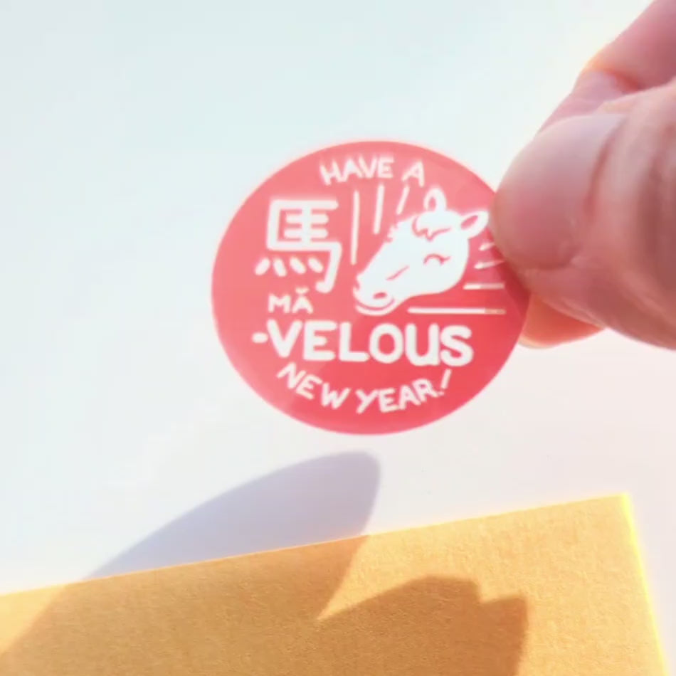 Clear and red sticker seal for gold of envelope to show through